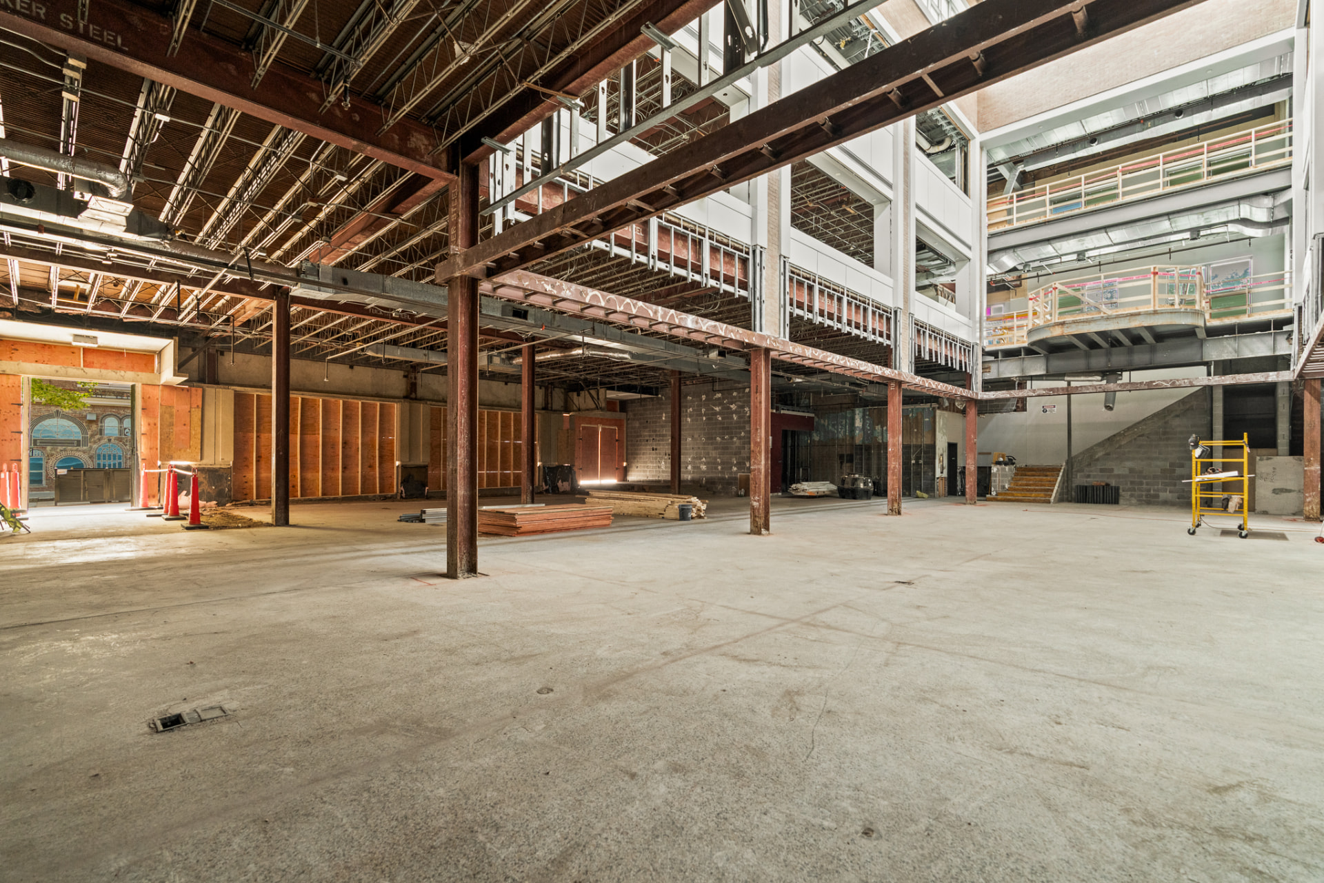 Commercial interior construction photography showing structural steel and open floor plan