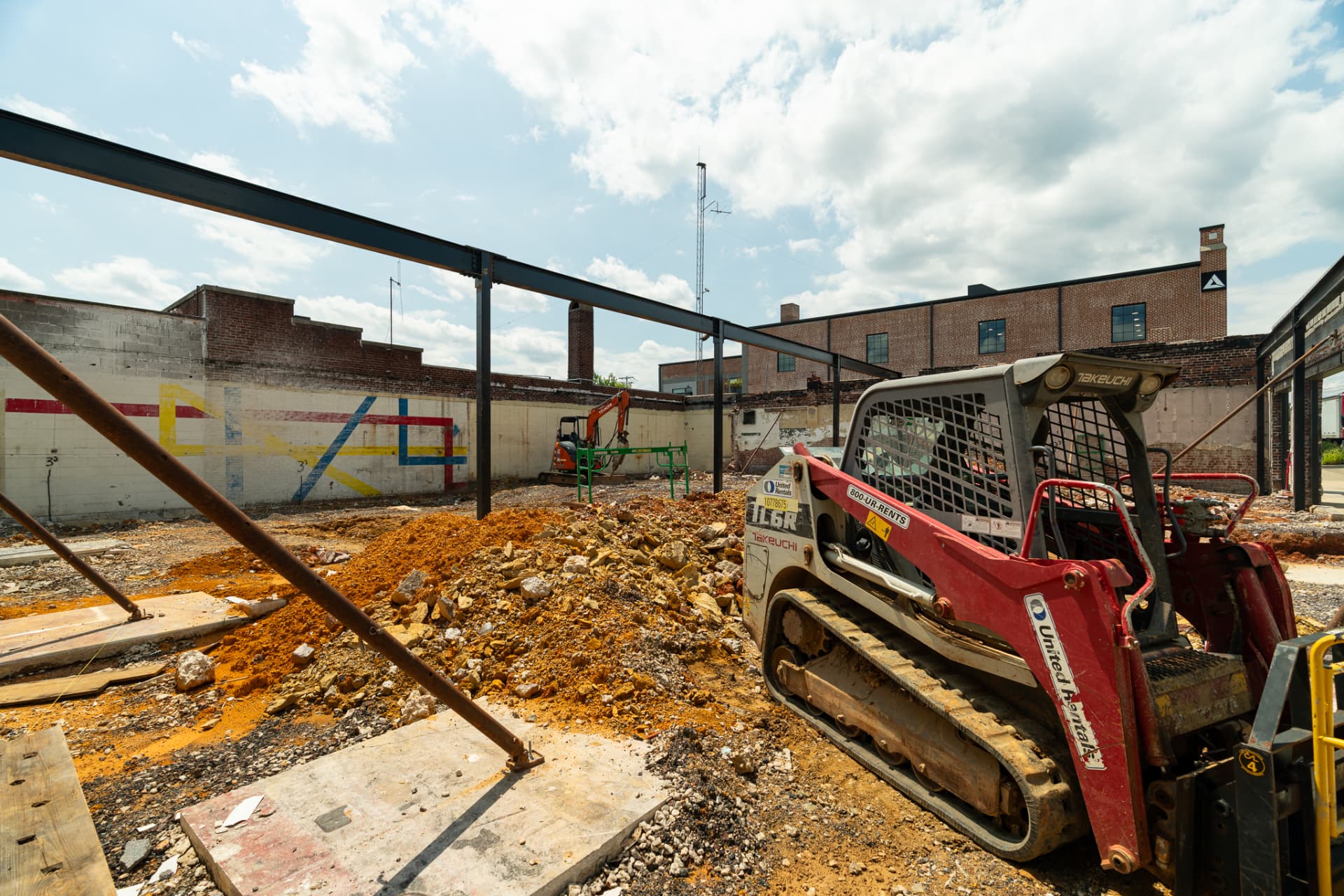 Construction equipment and new steel framing inside a commercial renovation