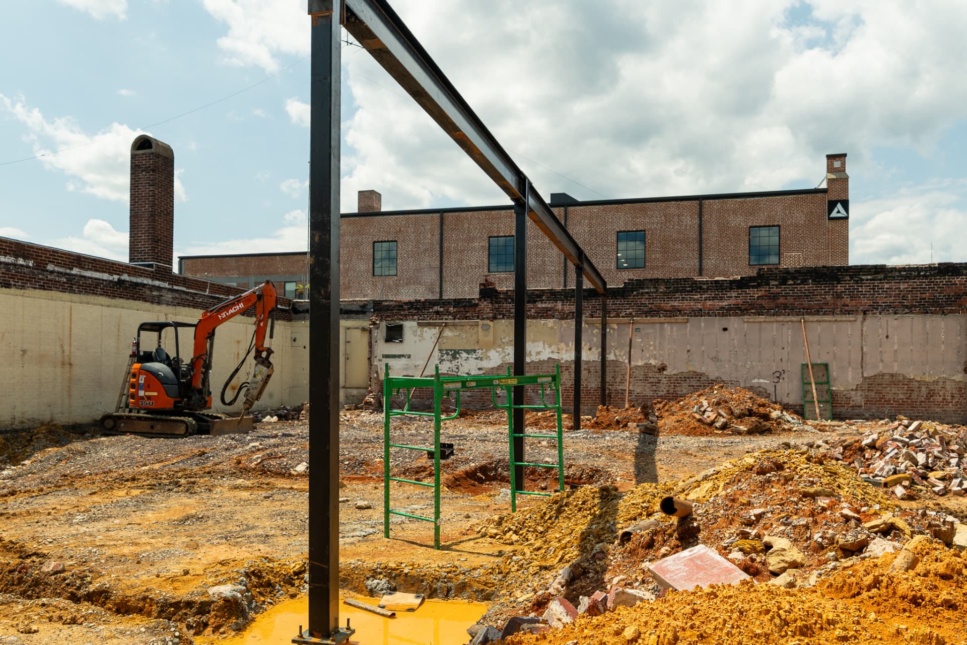 Structural steel framing progress at a downtown commercial construction site